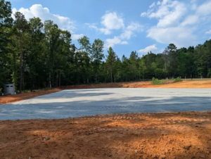 Completed 20m x 60m outdoor dressage arena with footing at Greymere Farm in Burlington, NC